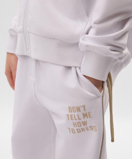 Брюки-джоггеры для девочки из футера белые Gulliver