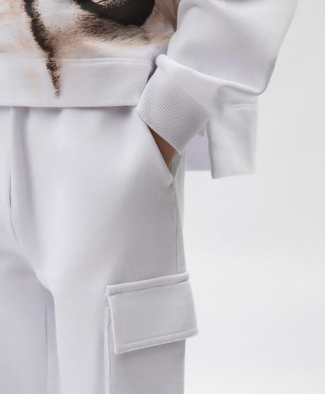 Брюки-джоггеры с карманами-карго для девочки из органического хлопка белые  (158) Gulliver