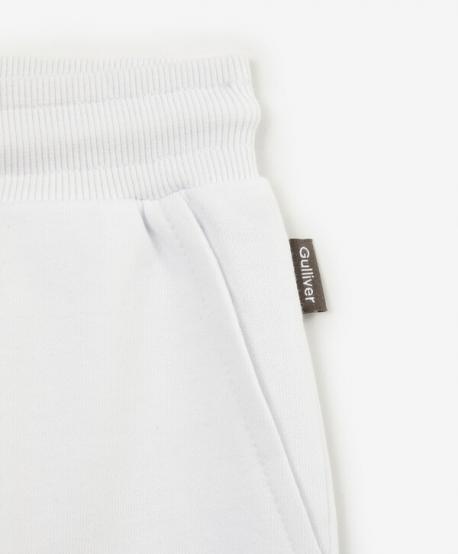 Брюки-джоггеры с карманами-карго для девочки из органического хлопка белые  (158) Gulliver